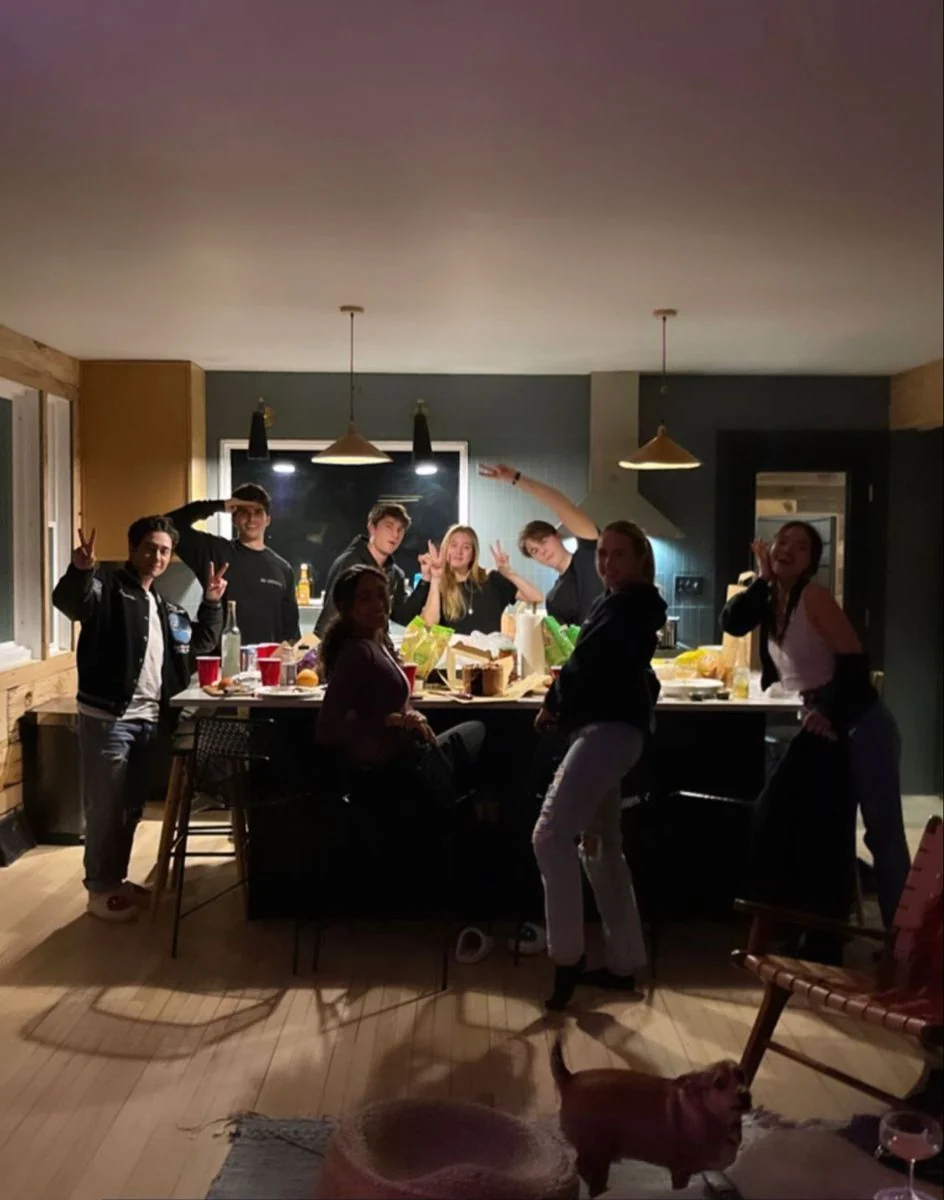 Friends gathered in a kitchen after a long day
