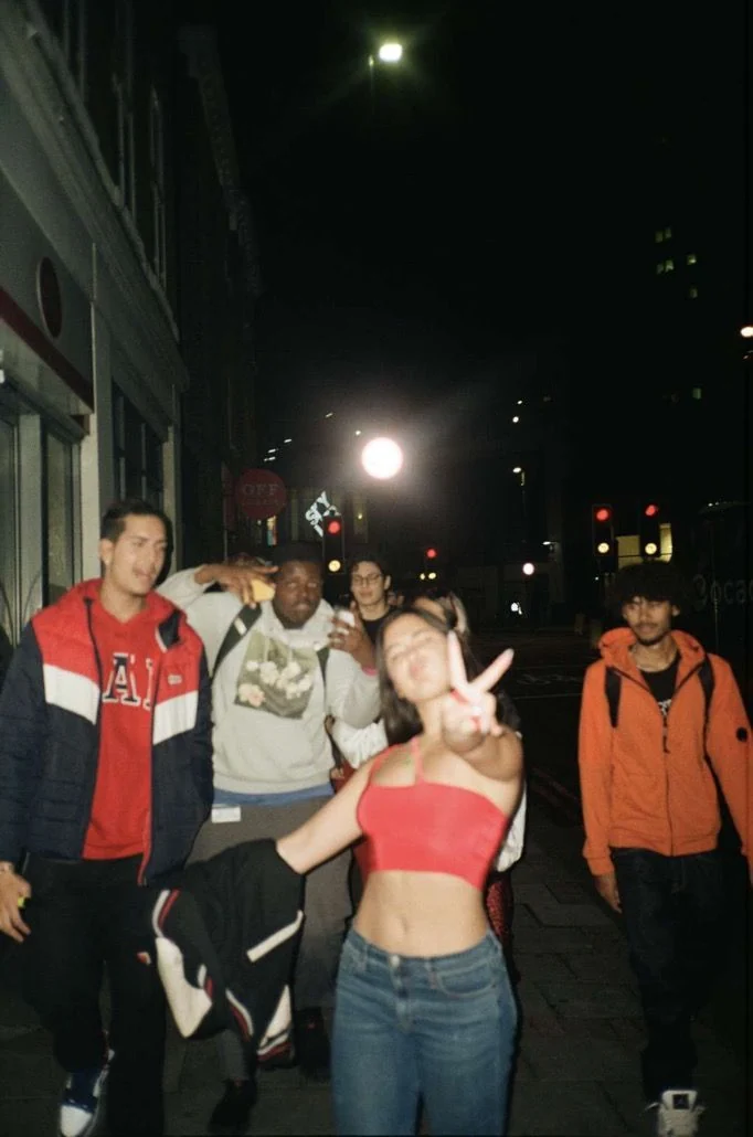 Friends walking through the city at night